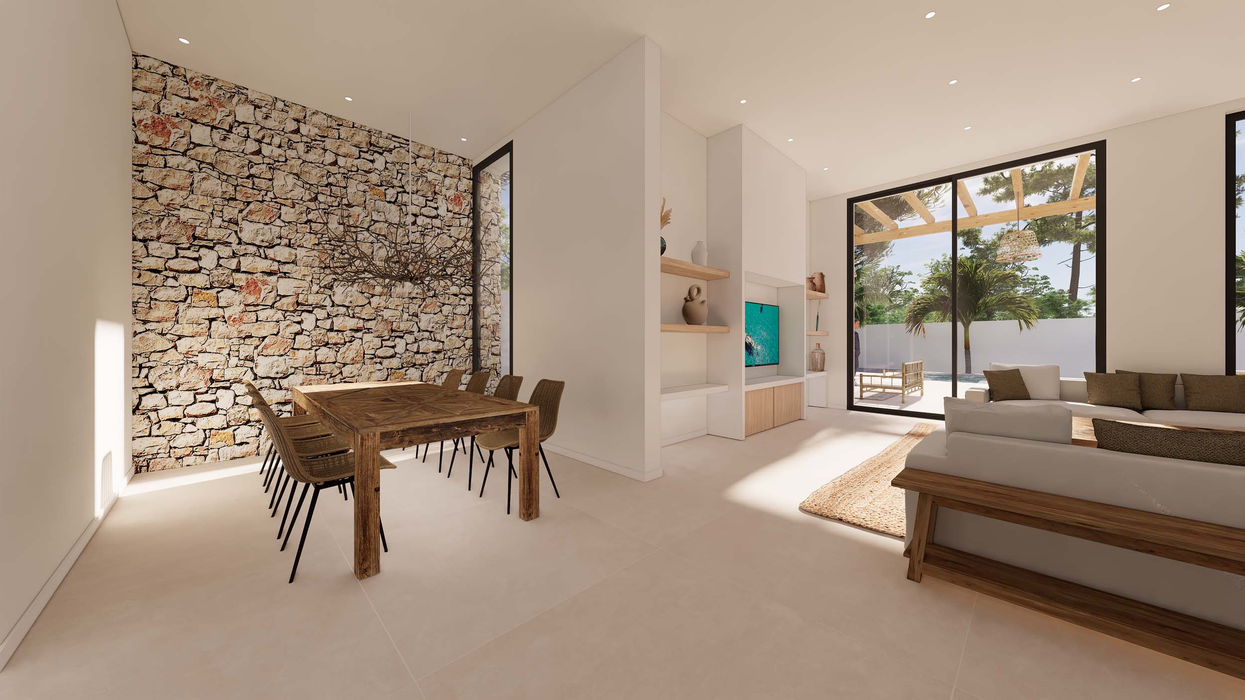 Espace de vie ouvert comprenant une salle à manger avec mur en pierre naturelle et un salon lumineux donnant sur la terrasse et le jardin méditerranéen.