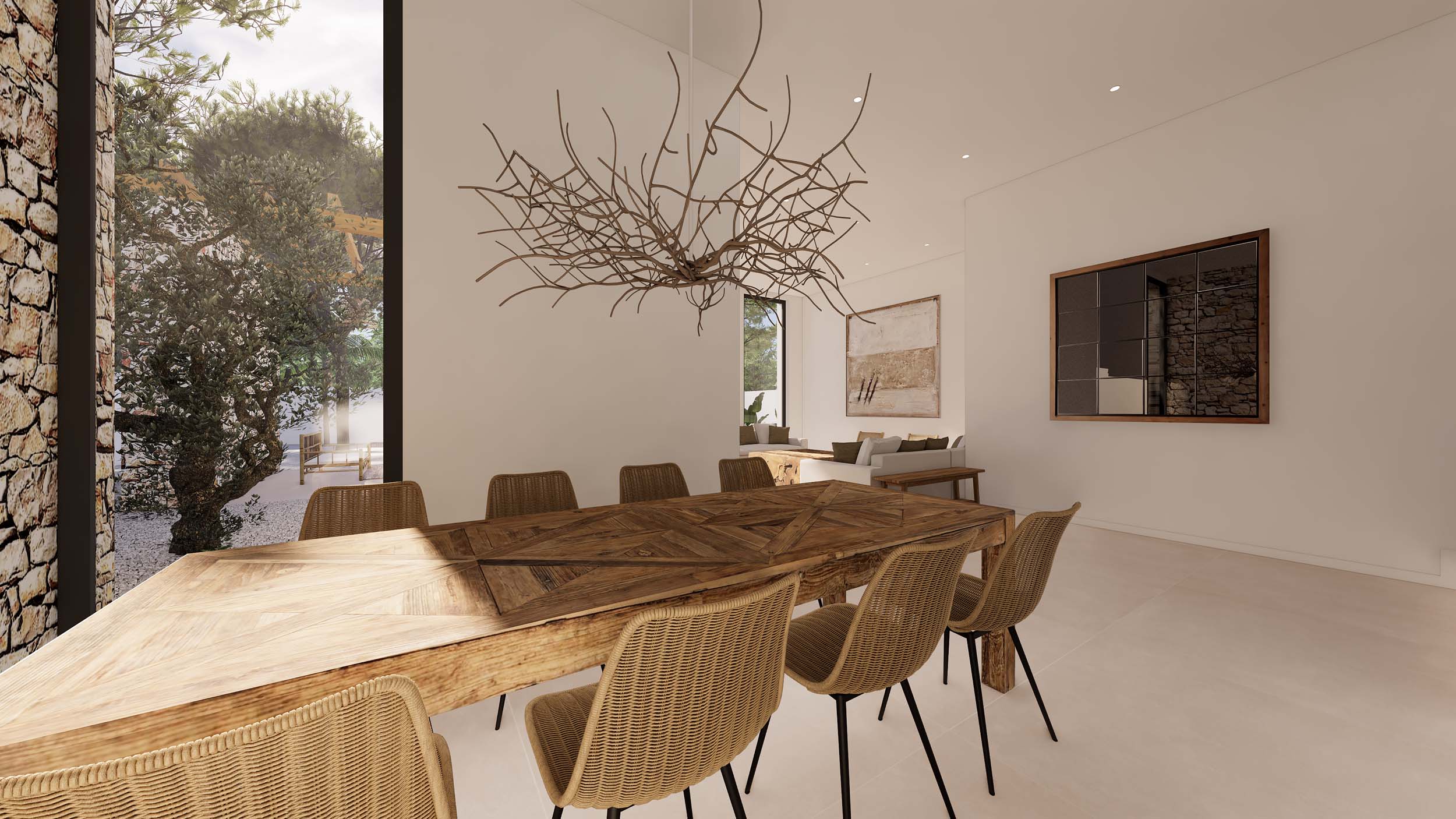 Espace salle à manger de style ibizien avec table en bois rustique et chaises en osier. Lustre sculptural en forme de branches et grande baie vitrée ouvrant sur le jardin et un mur en pierre.