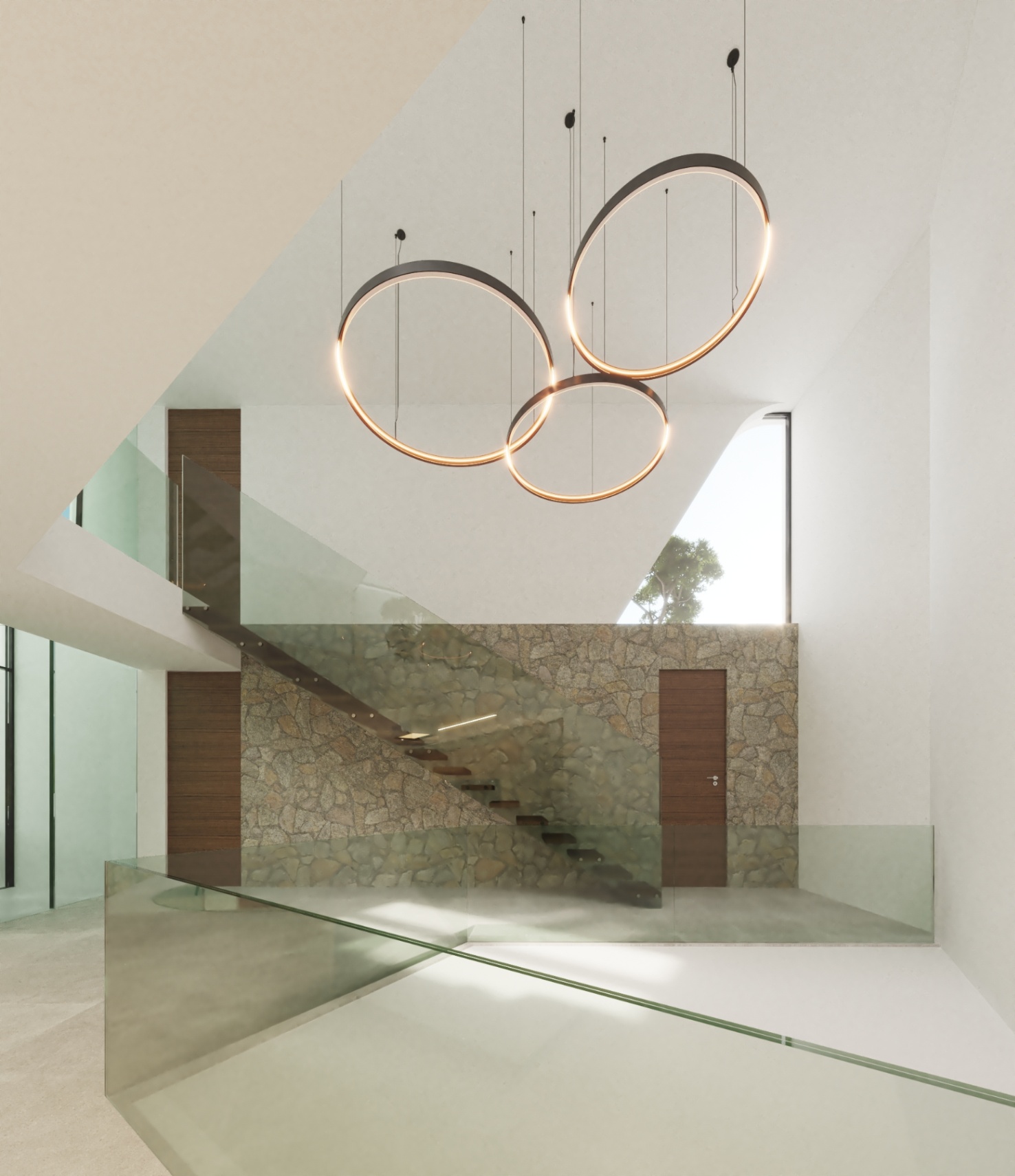 Escalier flottant avec marches en bois et garde-corps en verre, mis en valeur par un mur en pierre naturelle et des luminaires circulaires suspendus dans un espace épuré.