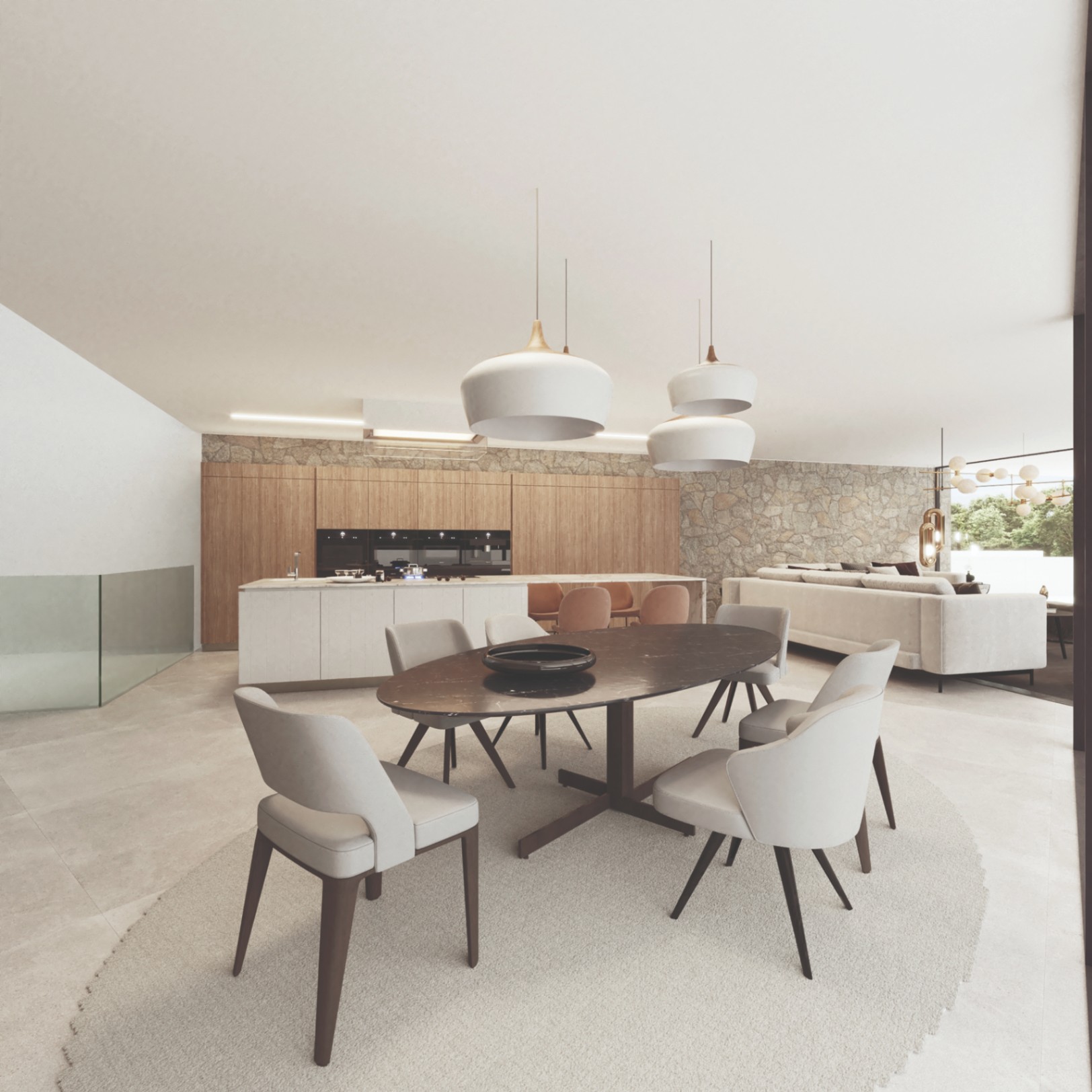 Espace dînatoire et cuisine ouverte avec table en marbre ovale, menuiserie en bois naturel et un mur en pierre sèche soulignant l'élégance contemporaine.