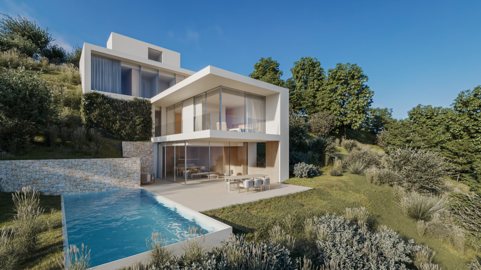 Vue extérieure de la villa moderne avec architecture cubique blanche, piscine à débordement et murs en pierre naturelle intégrés dans la colline paysagère.