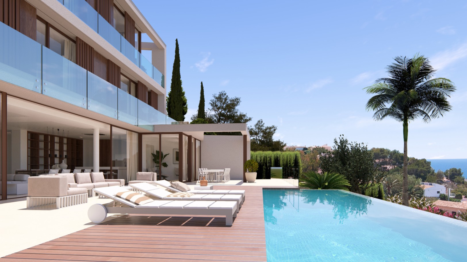 Vue sur la piscine à débordement avec terrasse en bois et chaises longues, donnant sur la mer et la verdure luxuriante.