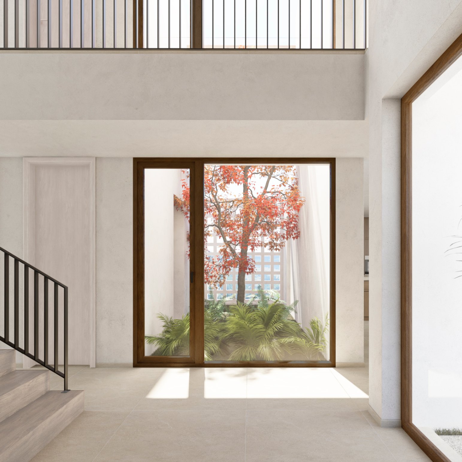 Vue intérieure de la villa avec escalier en bois et fenêtre donnant sur un jardin intérieur avec un arbre aux feuilles rougeâtres.