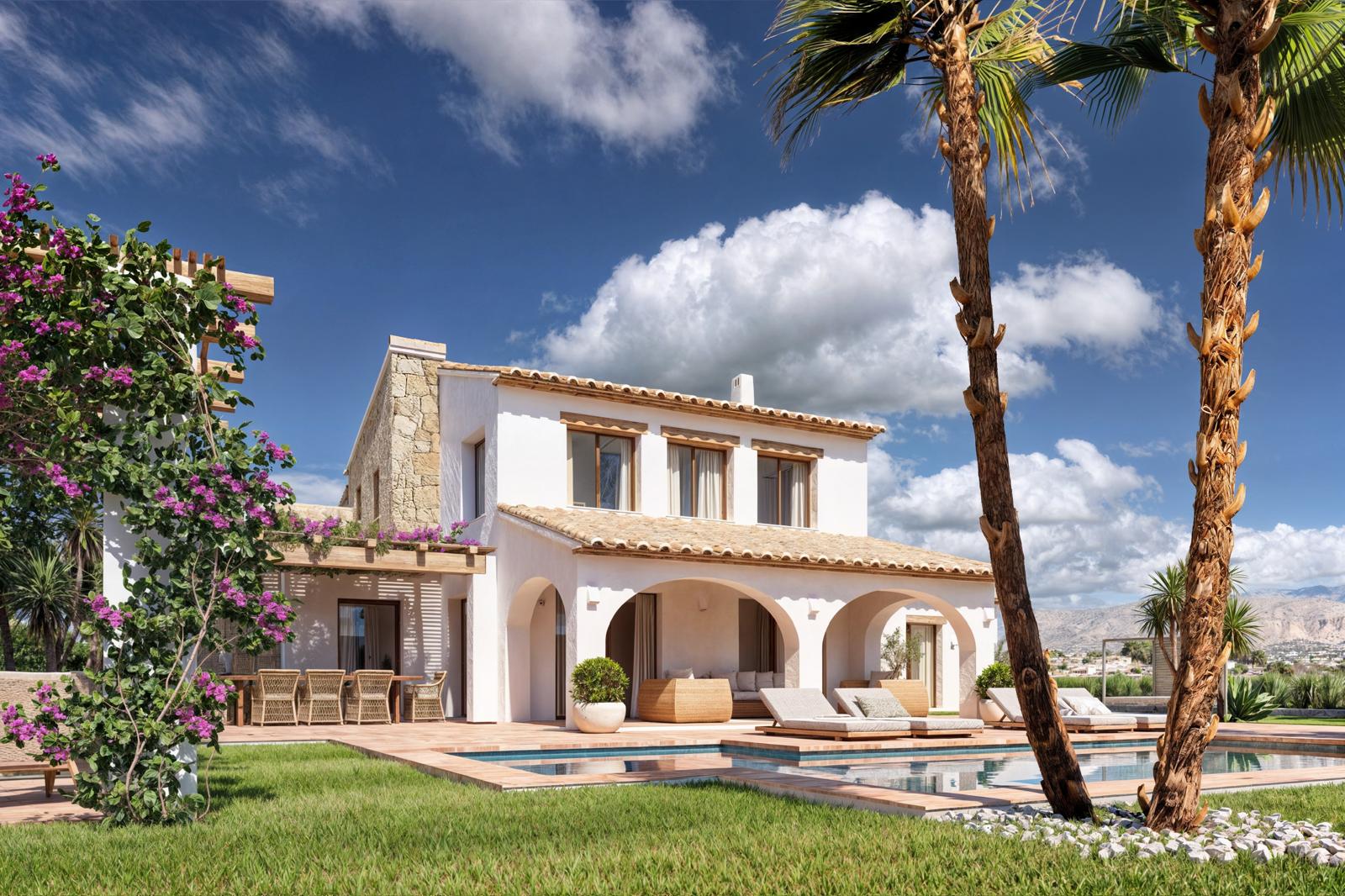 Façade de la villa avec porche à arcades, piscine entourée de pelouse et coin repas sous une pergola en bois avec bougainvilliers, offrant une vue sur les montagnes.