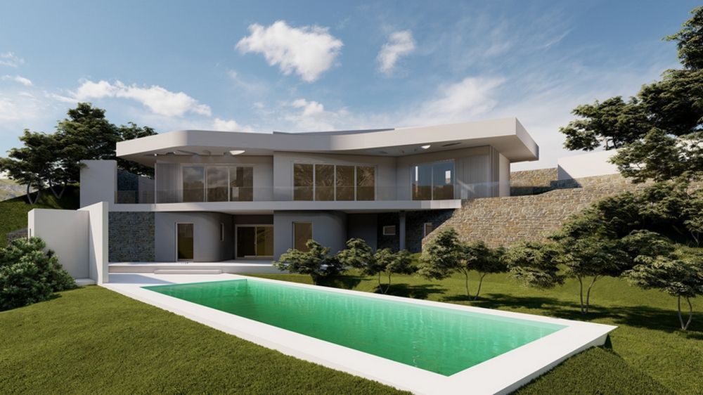 Vue extérieure de la villa avec façade blanche, murs en pierre naturelle et piscine rectangulaire entourée d'un jardin méditerranéen avec pelouse.