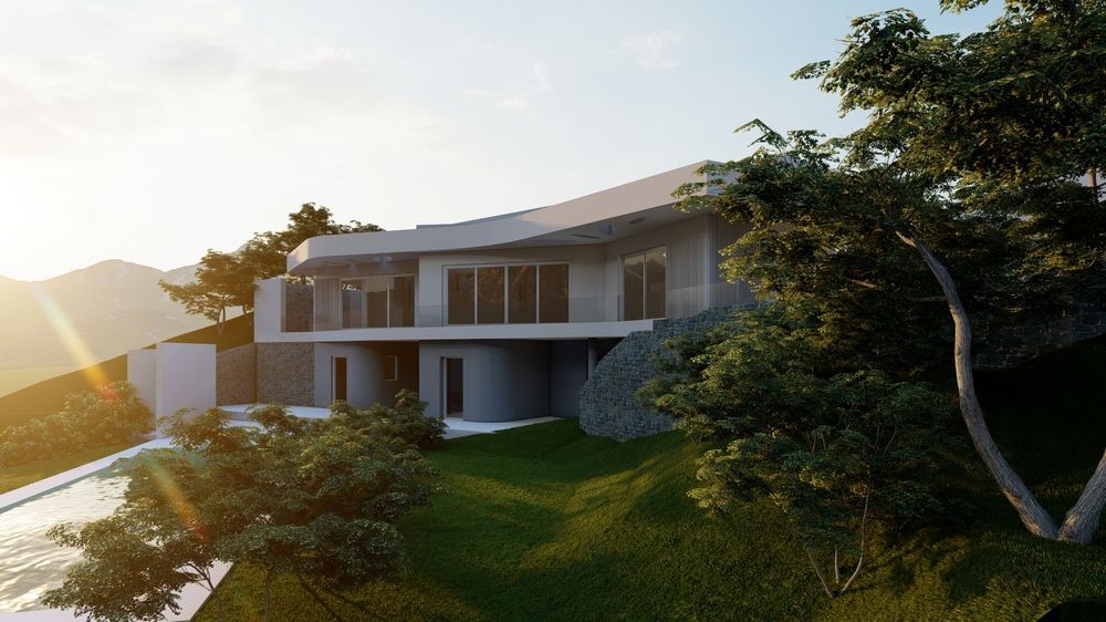 Vue extérieure de la villa contemporaine avec toiture incurvée, murs en pierre naturelle et larges baies vitrées sur un terrain en pente avec jardin méditerranéen.