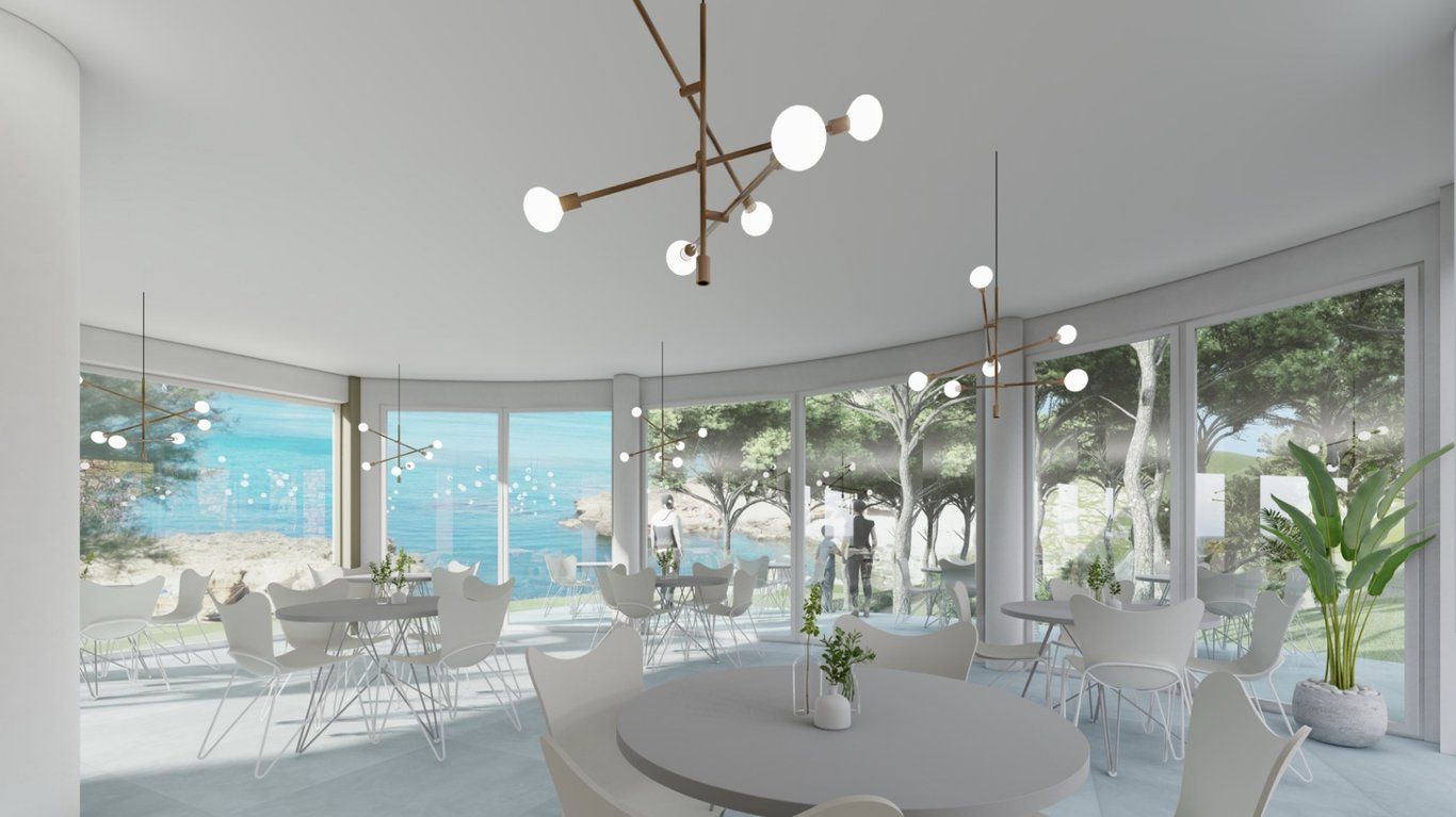 Salle à manger lumineuse dotée de baies vitrées incurvées, vue sur la Méditerranée, mobilier minimaliste blanc et luminaires suspendus au design contemporain.