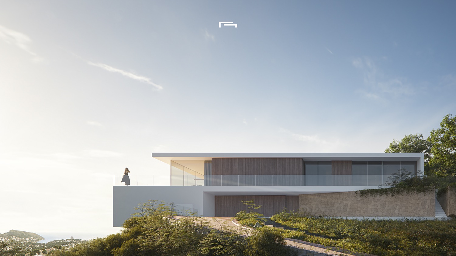 Vue extérieure de la villa moderne avec façade blanche, panneaux de bois et murs en pierre. La terrasse en porte-à-faux avec garde-corps en verre offre une vue panoramique sur la mer.