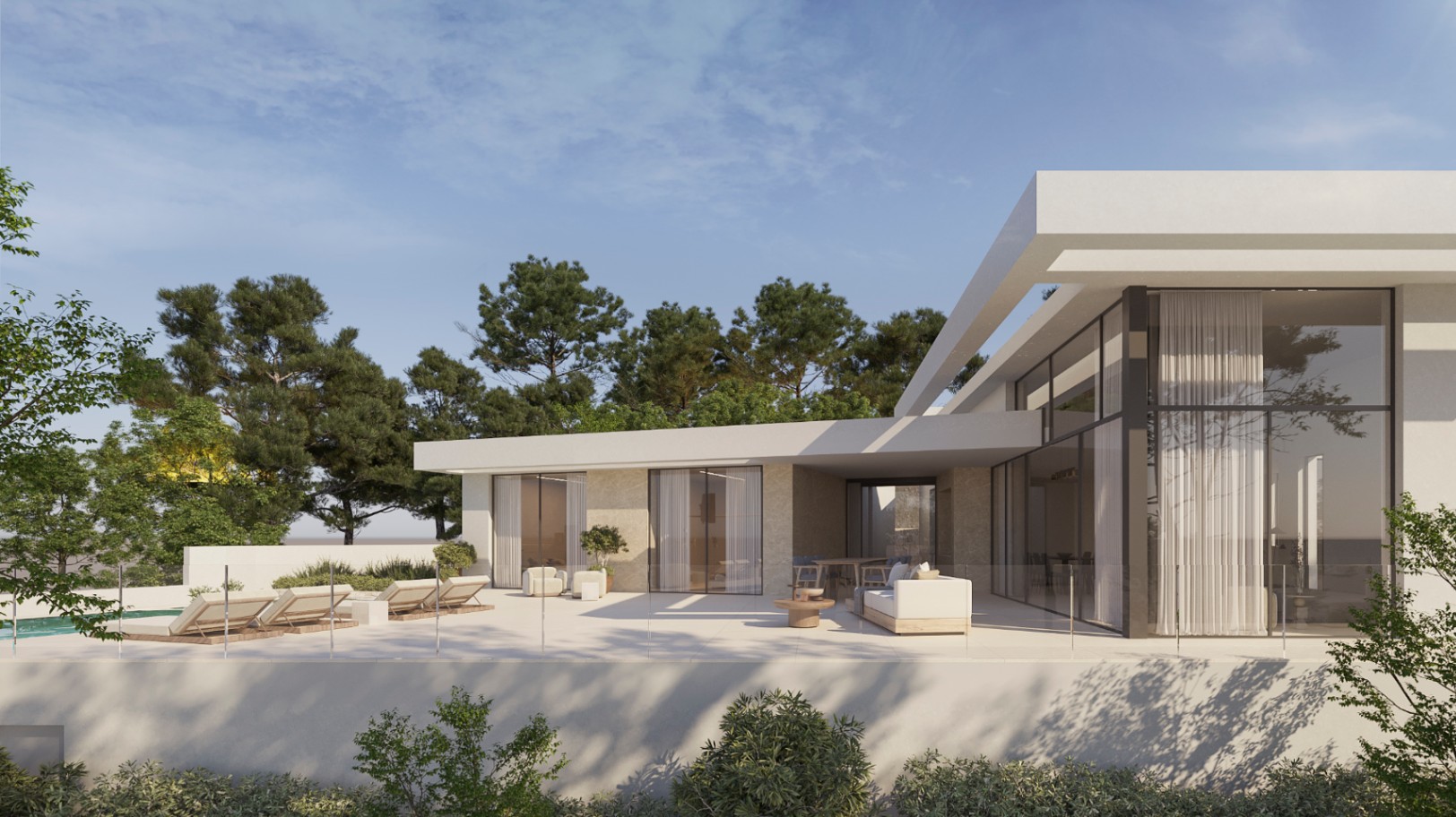 Extérieur de villa moderne avec vaste terrasse, salon d'été et baies vitrées toute hauteur, alliant une façade blanche épurée à des parements en pierre naturelle.