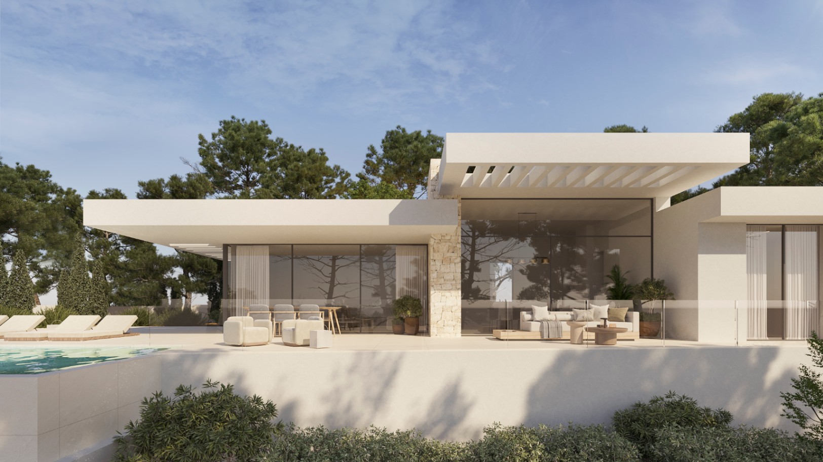 Façade de villa moderne avec murs en pierre naturelle, baies vitrées toute hauteur et terrasse spacieuse comprenant salon extérieur, salle à manger et piscine.