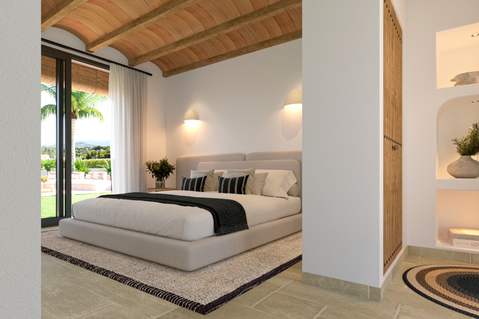Chambre principale avec plafond voûté en briques et poutres apparentes, sol en pierre naturelle et accès direct à la terrasse avec vue sur le jardin.