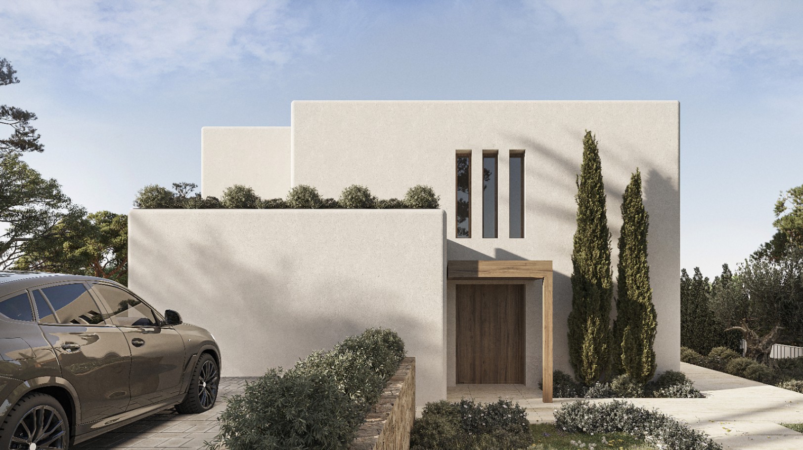 Façade moderne de villa à Benissa avec porte en bois et verdure soignée.