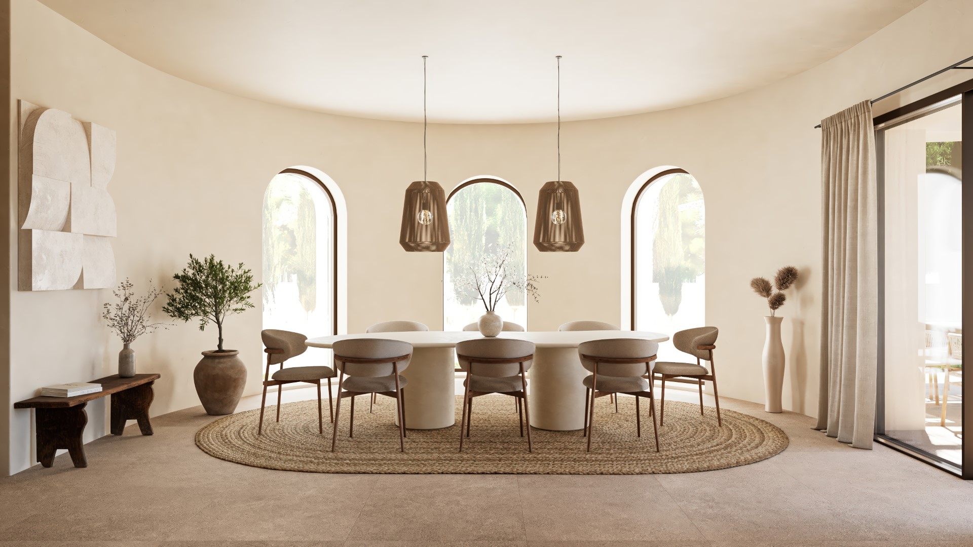Salle à manger raffinée avec table ovale en pierre, chaises design et tapis en jute. La pièce se distingue par son mur courbe orné de trois fenêtres en plein cintre.