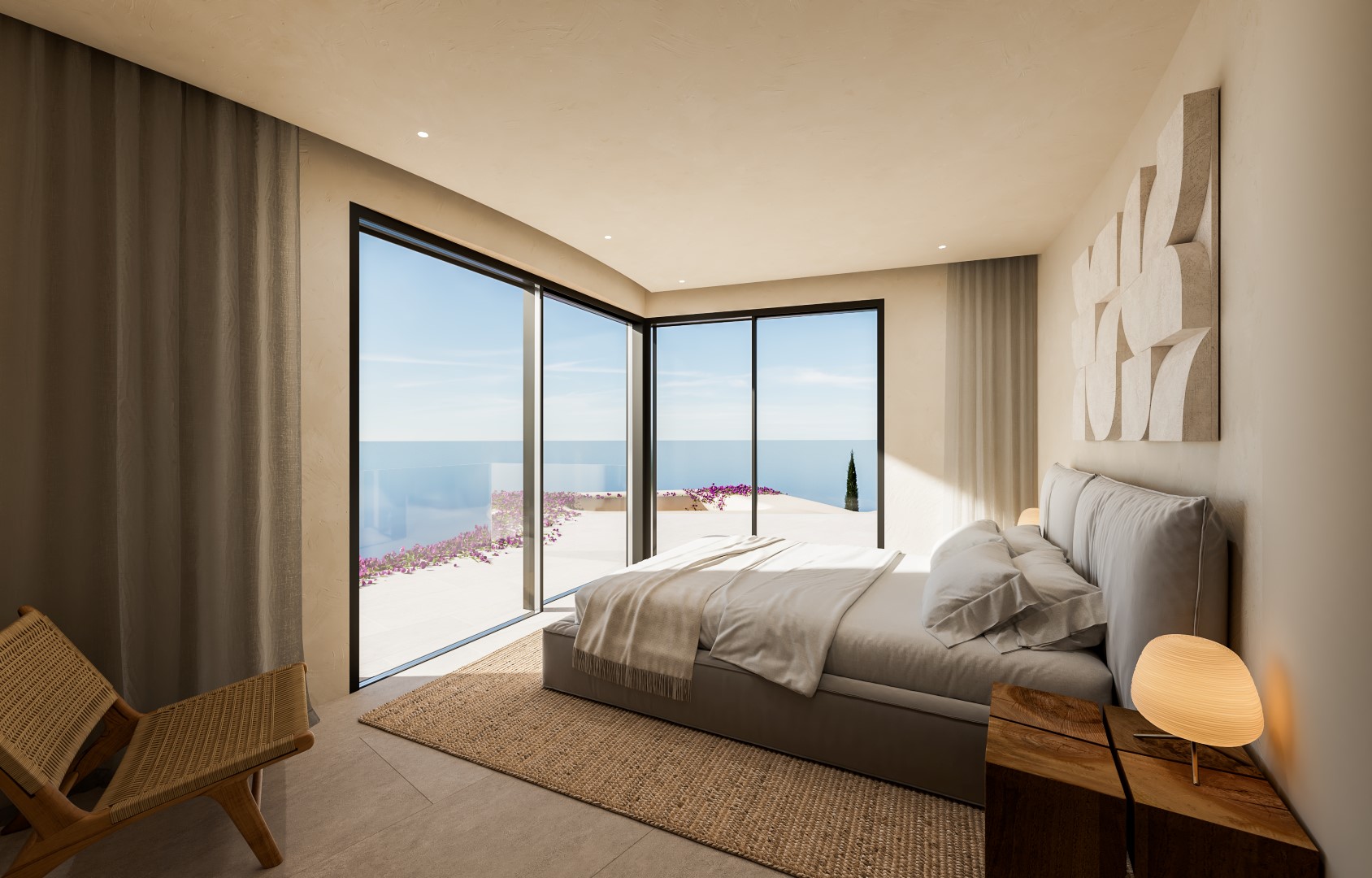 Chambre principale avec baies vitrées en angle offrant une vue sur la mer, finitions en tons terre, tapis en jute et mobilier en bois naturel.