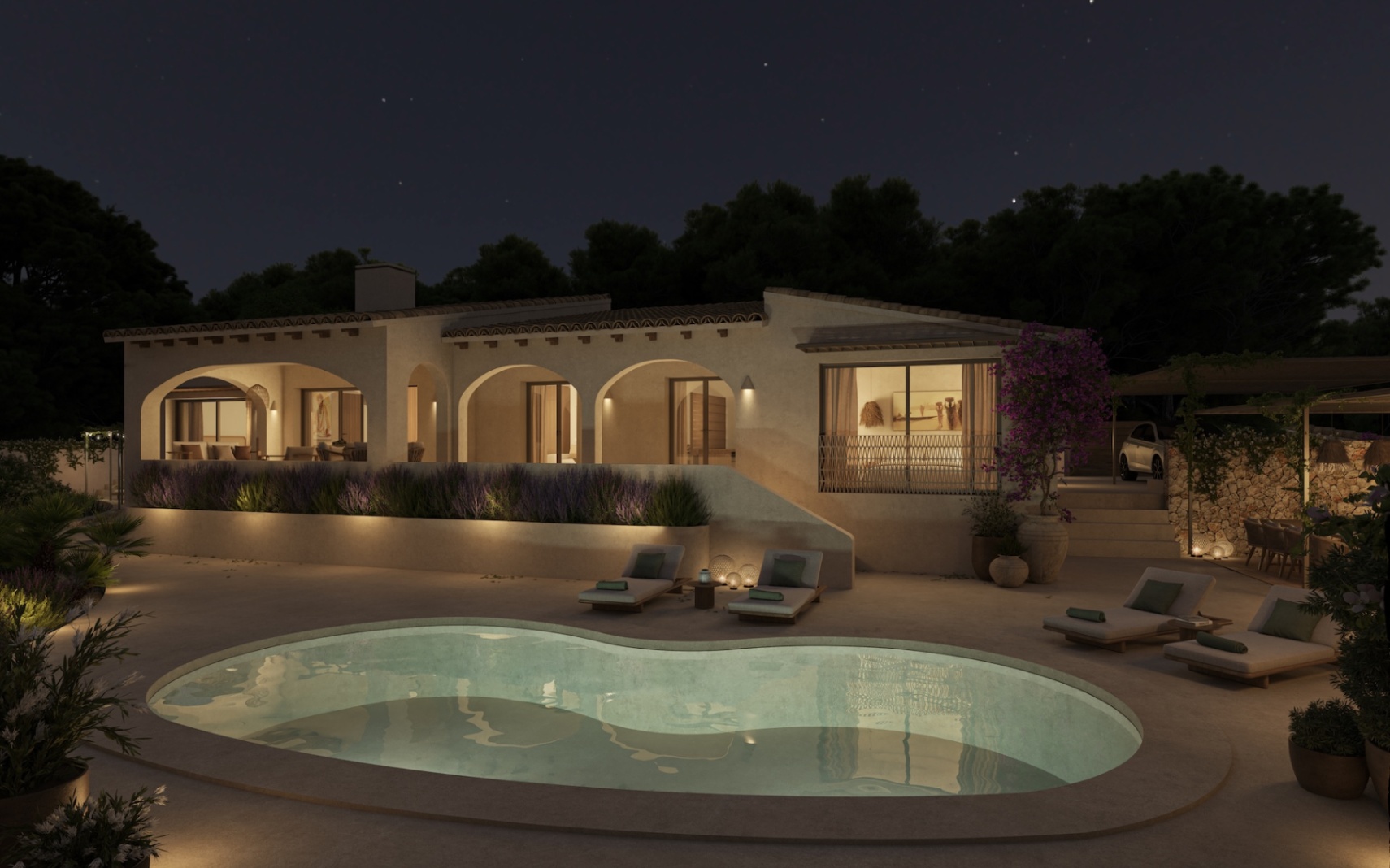 Vue nocturne de la villa avec piscine de forme libre, porches à arcades éclairés et terrasses aménagées entourées de jardins méditerranéens.