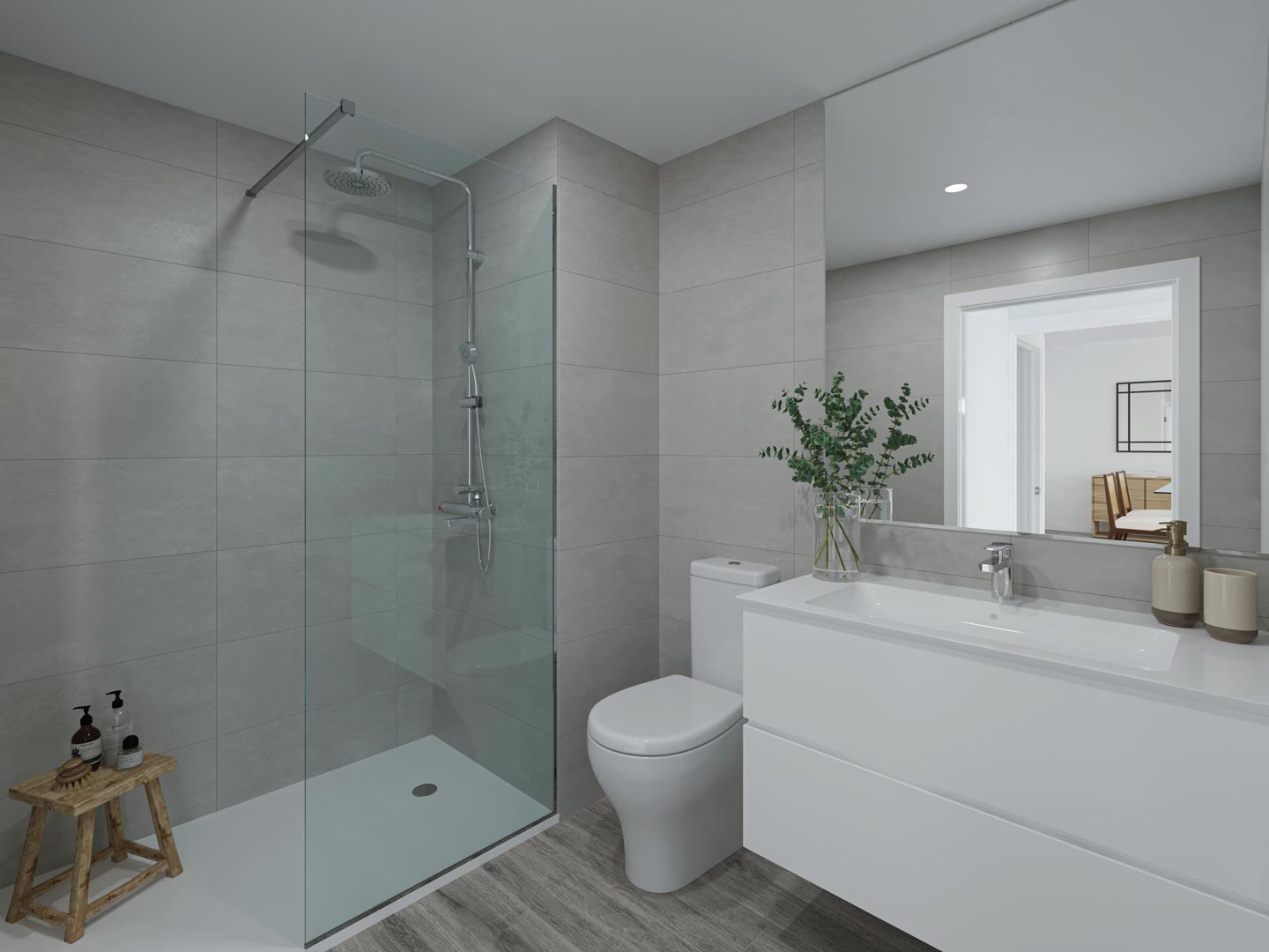 Salle de bain moderne avec douche à l'italienne, paroi en verre, carrelage gris, meuble vasque suspendu blanc et sol imitation bois élégant.