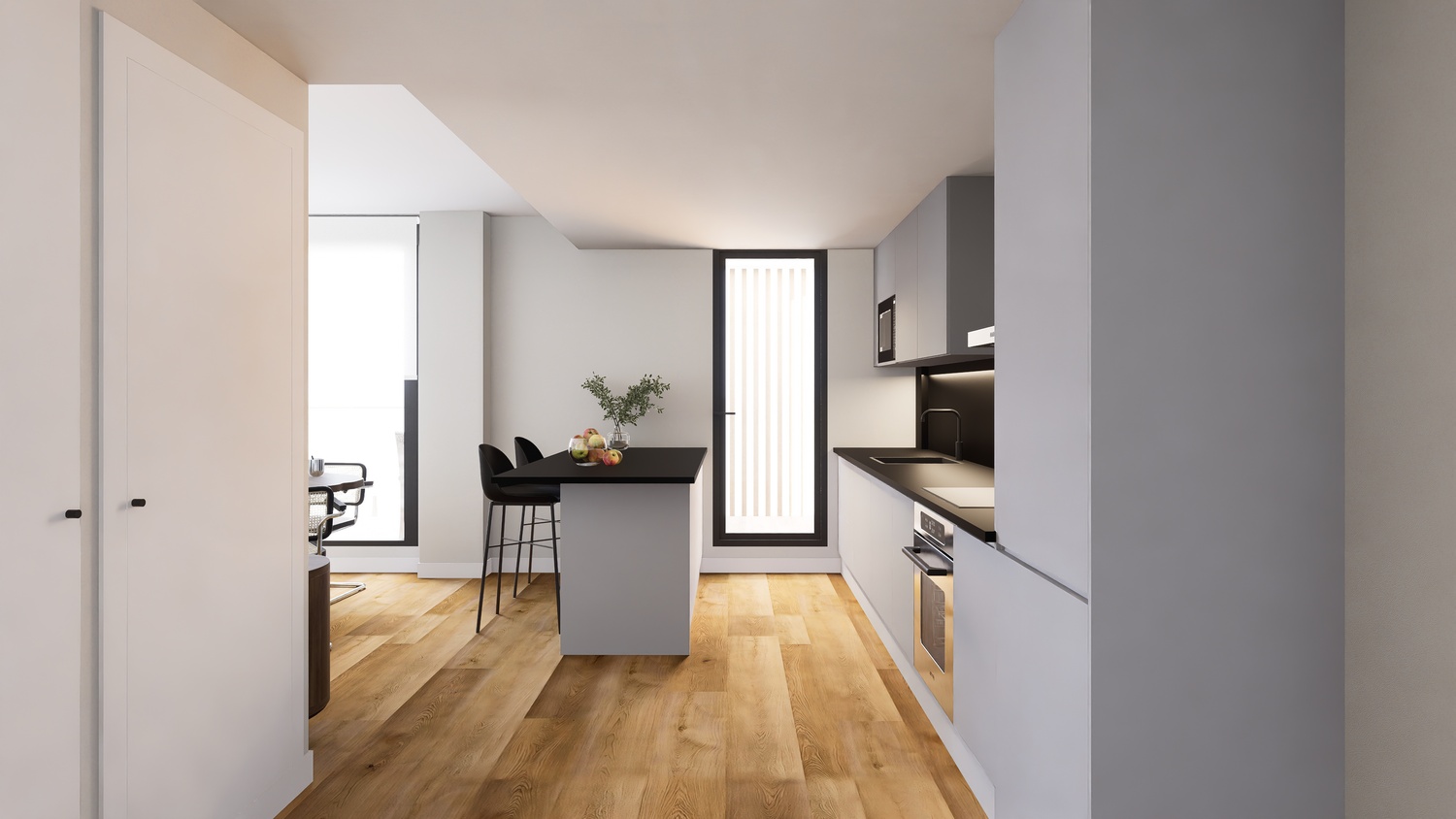 Cuisine moderne à aire ouverte avec armoires grises, plans de travail noirs et îlot central. Le parquet en bois clair complète cet espace lumineux et minimaliste.