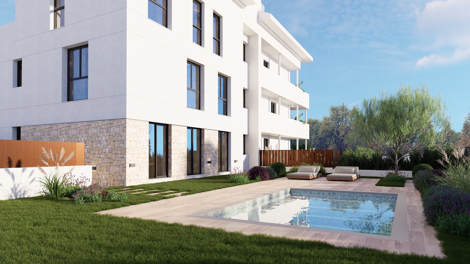 Vue extérieure du bâtiment de trois étages avec façade blanche et pierre, piscine commune avec terrasse en bois et jardins paysagers avec lavande.
