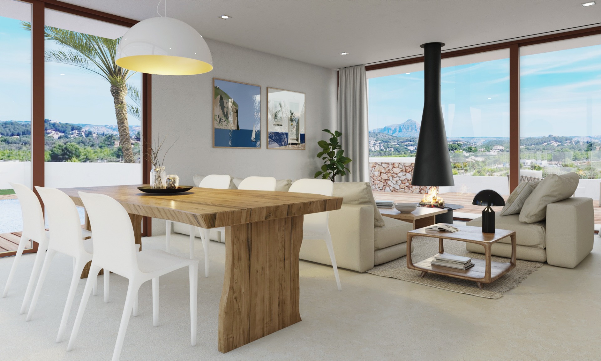Espace de vie ouvert comprenant une table en bois massif, une cheminée suspendue moderne et de larges baies vitrées offrant une vue sur le Montgó.