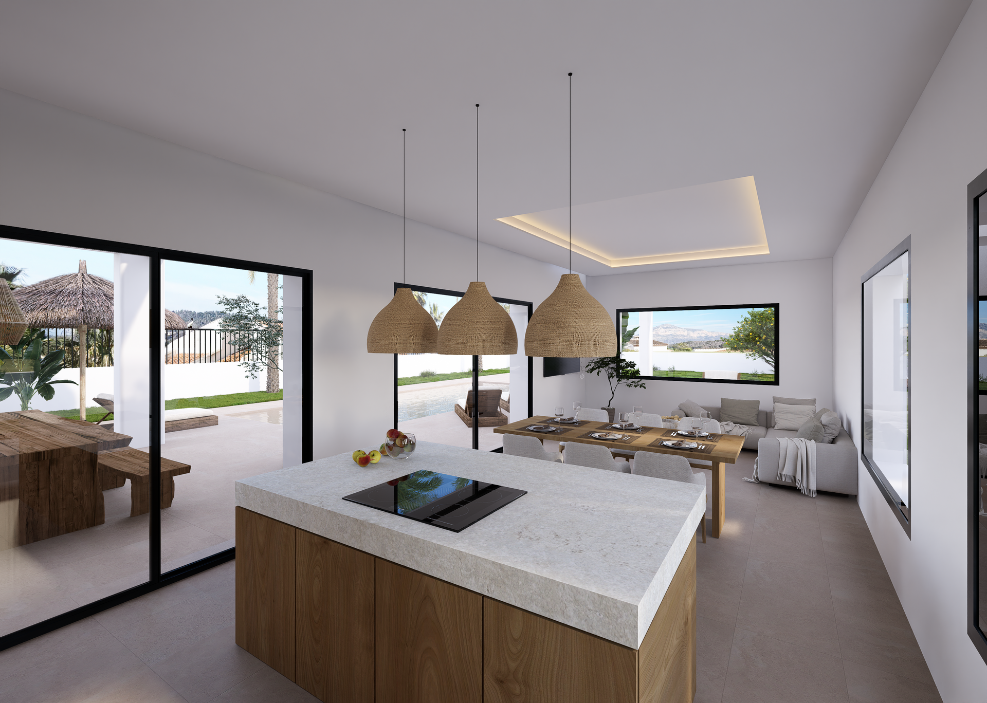 Espace de vie ouvert comprenant un îlot de cuisine en pierre, une salle à manger et un salon lumineux avec accès direct à la terrasse par de grandes baies vitrées.