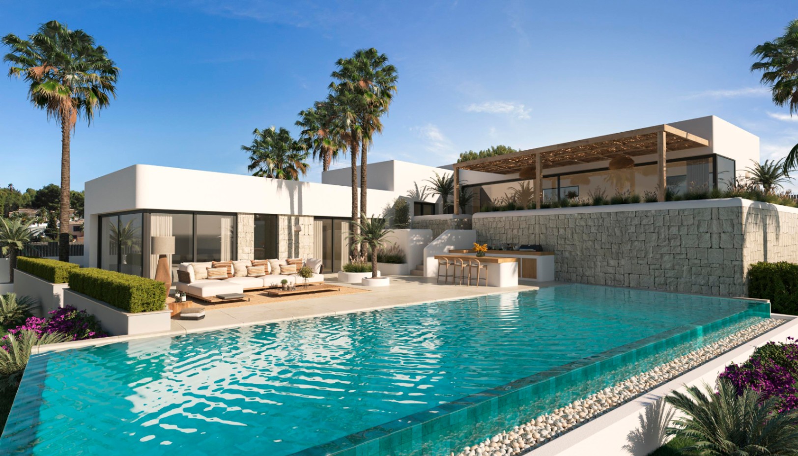 Extérieur de villa moderne avec piscine à débordement, terrasse aménagée et cuisine d'été, entouré de murs en pierre naturelle et de palmiers.
