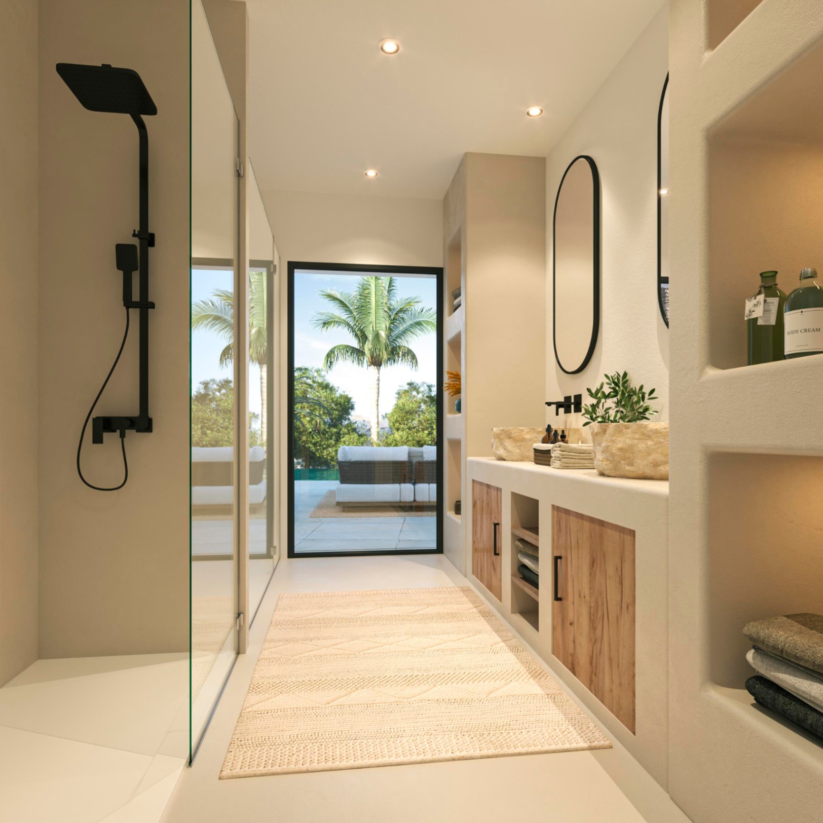 Salle de bain contemporaine avec vasques en pierre, robinetterie noire et douche à l'italienne. Une grande porte vitrée offre un accès direct vers la terrasse extérieure.